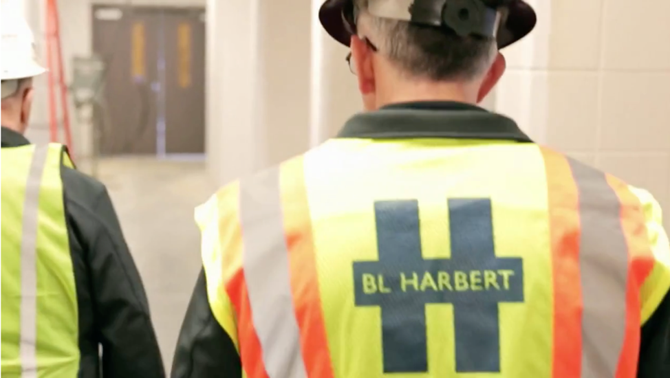 Employee wearing a BL Harbert-branded safety vest