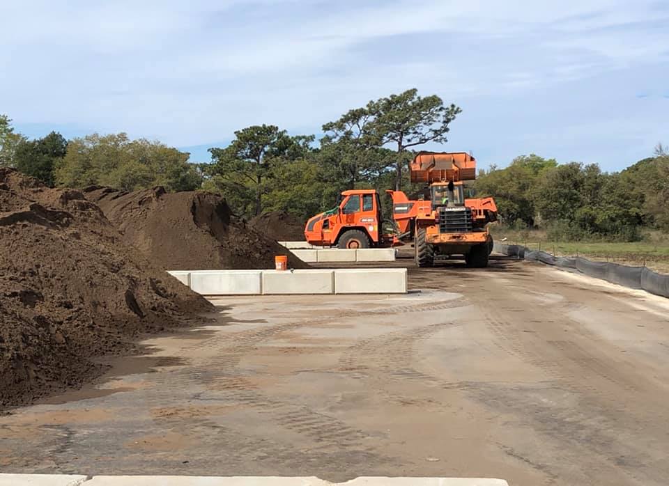 Stock piles of good soil and perimeter fencing for excavation and remediation
